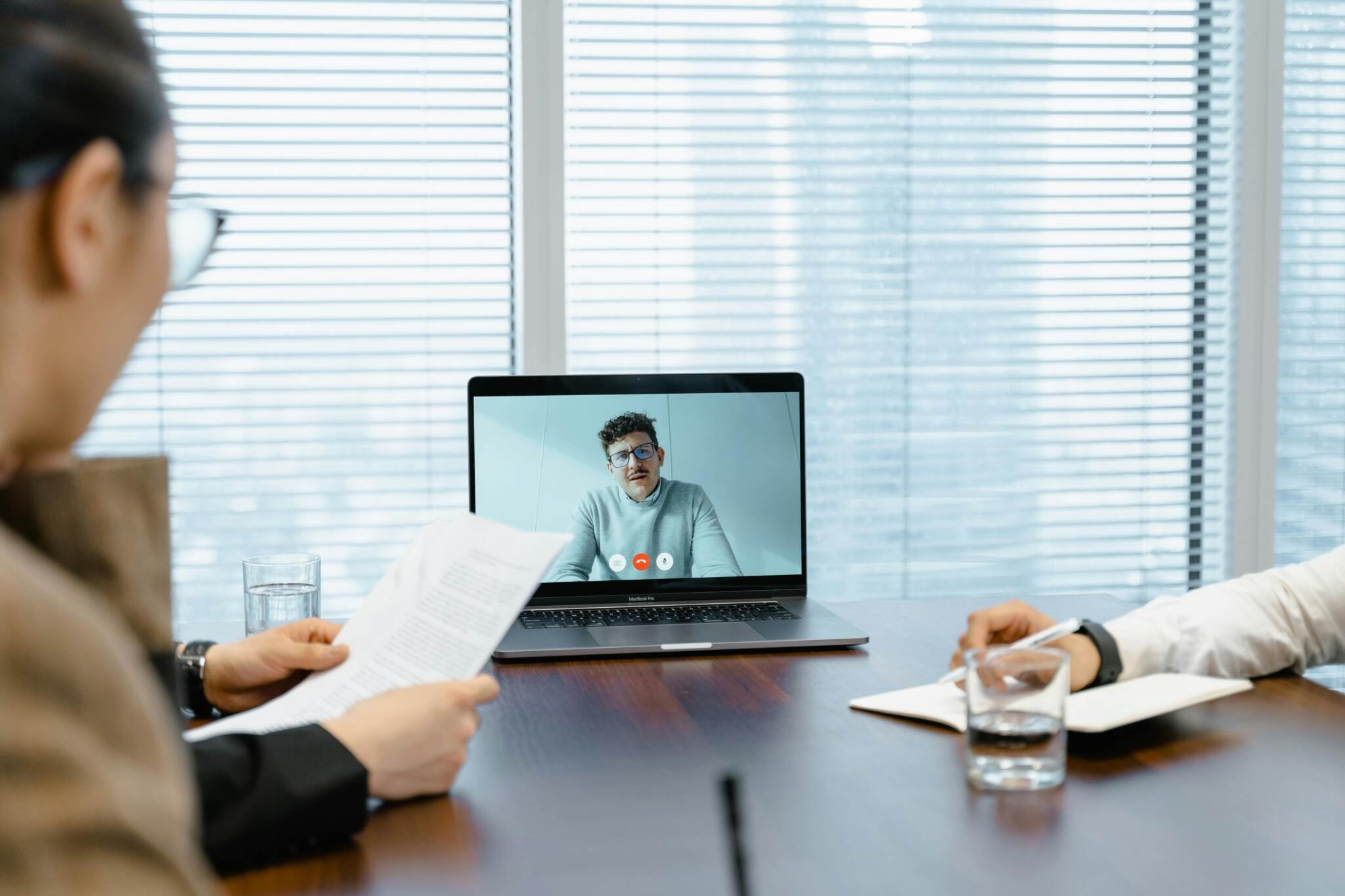 Two people sitting at a conference table