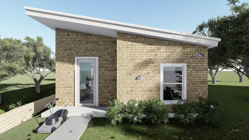 a brick house with a lawn and a patio